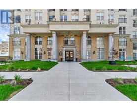 A building entrance with a walkway leading to it.