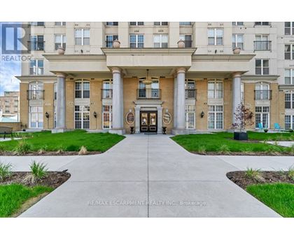 A building entrance with a walkway leading to it.