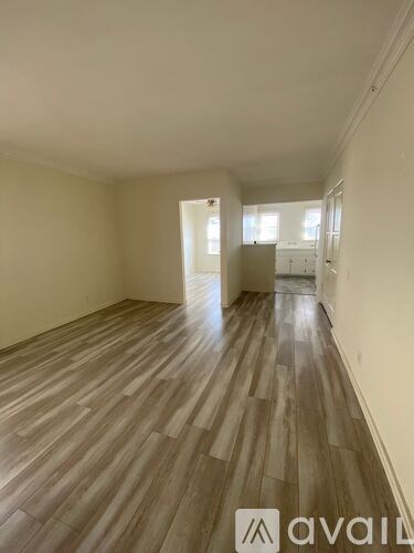 A room with wooden flooring and a logo that reads "avail" on the bottom right.