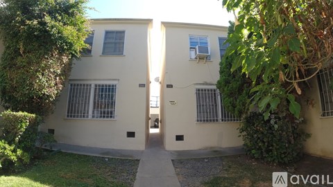 Two houses are connected by a small alley.