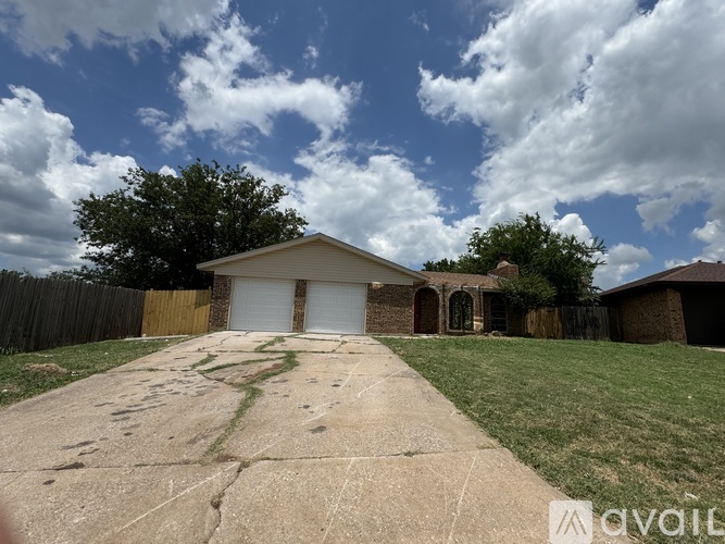 A house with a driveway in front of it.