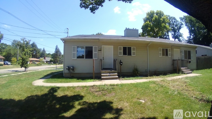 A house with a lawn in front of it is for sale.