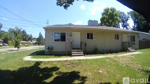 A house with a lawn in front of it is for sale.