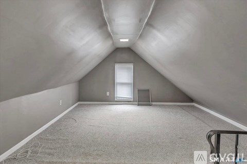 A spacious room with a door and a window.