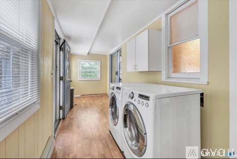 A laundry room with a washer and dryer.