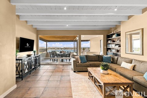 A kitchen with blue cabinets and a tile backsplash.