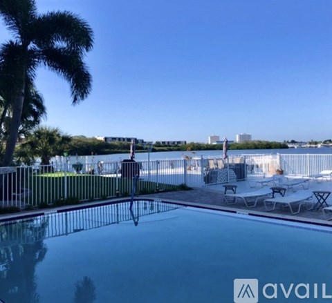 A pool with a view of a city skyline.