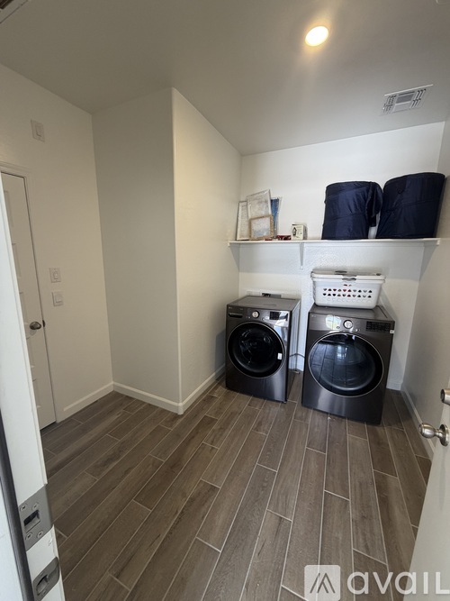 A laundry room with a washer and dryer.