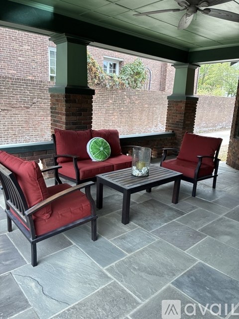 A patio with a table and chairs.