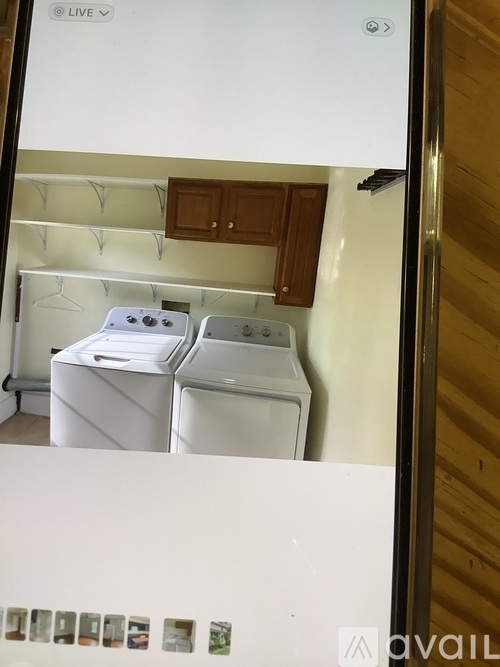 A white fridge with a photo gallery on the bottom.