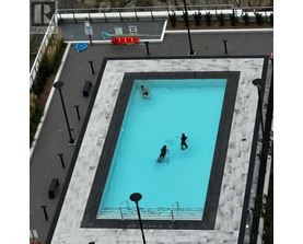 A swimming pool with people in it.