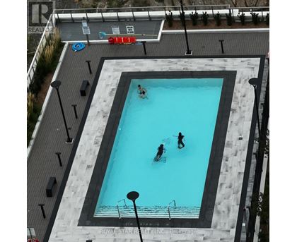 A swimming pool with people in it.