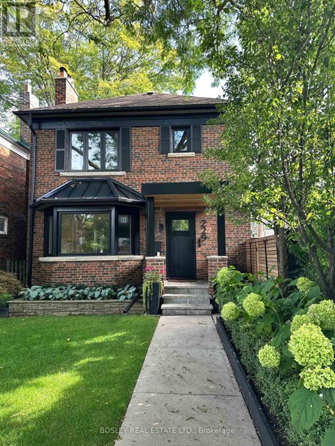 A house with a green lawn and a black door.