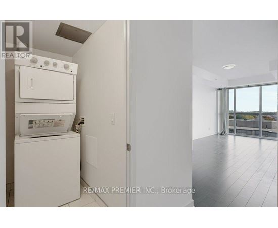 A white dishwasher and oven in a kitchen.