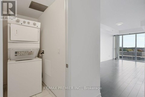A white dishwasher and oven in a kitchen.