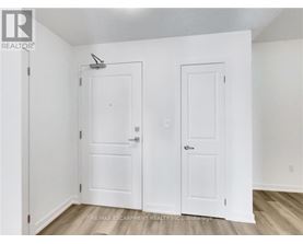 A white door with a small window above it.