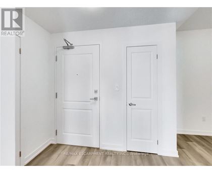 A white door with a small window above it.