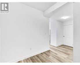 A white room with a door and a window.