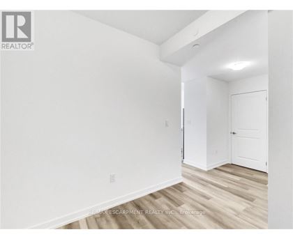 A white room with a door and a window.