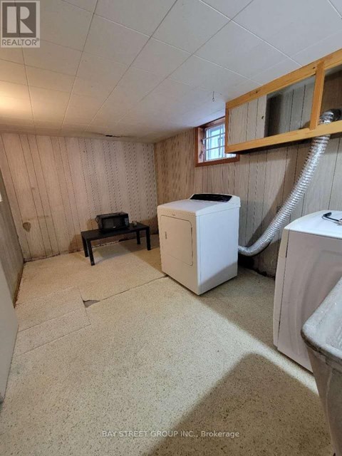 A small room with a washer and dryer in it.