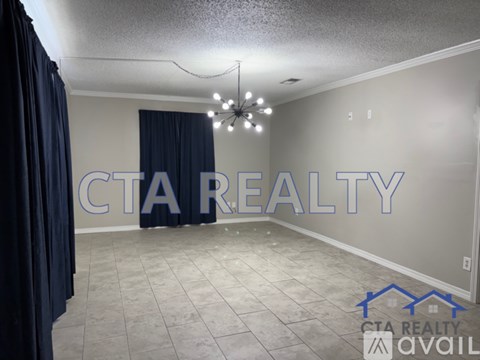 A room with a sign that says CTA Realty.