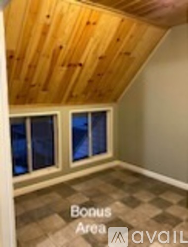 Bonus Area Avail sign on a wall in a room.