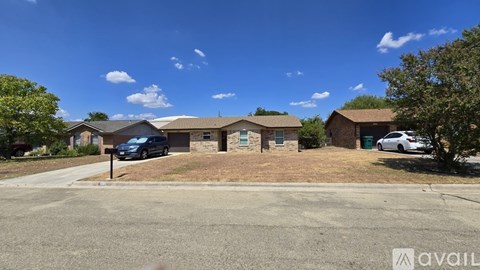 A house with a car parked in front is available for sale.