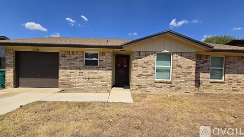 A two-story house with a garage is for sale.