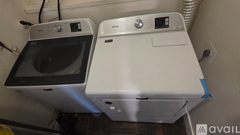 A washing machine and dryer are side by side.