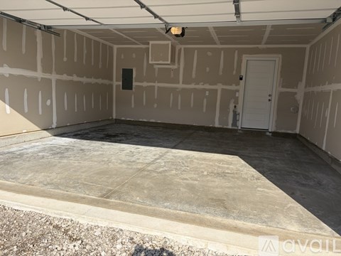 A room under construction with drywall installed on the walls.