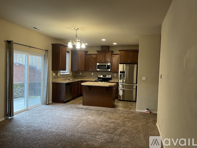A kitchen with brown cabinets and a white countertop.