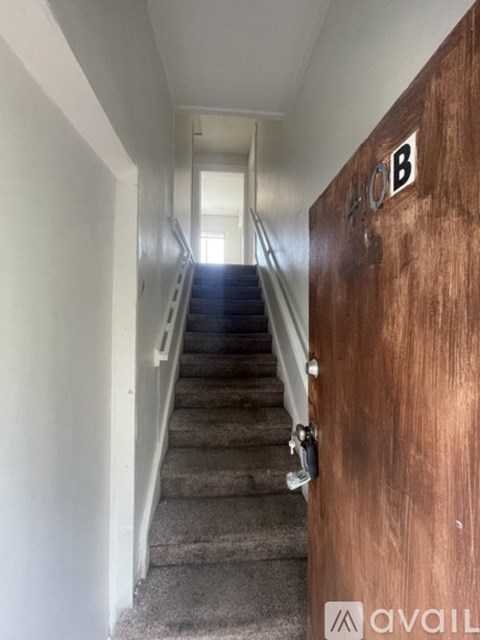A brown door with the number 408 on it.