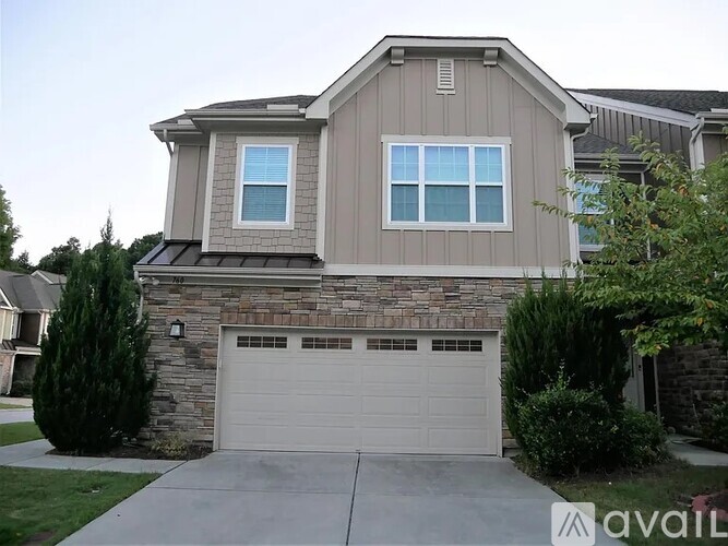 A house with a garage and a driveway.