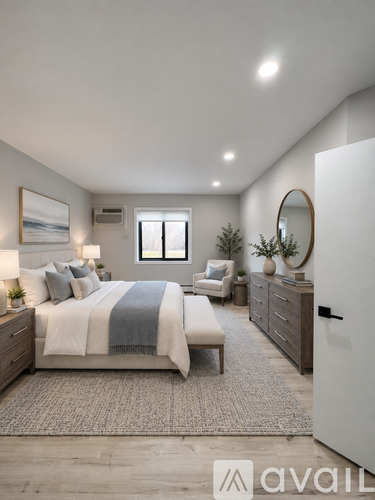 A bedroom with a bed, a chair, a dresser, and a mirror.