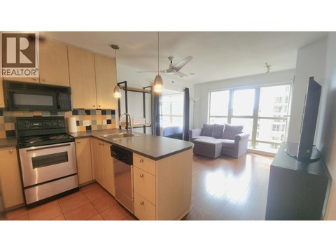 A kitchen with a bar stool and a counter.