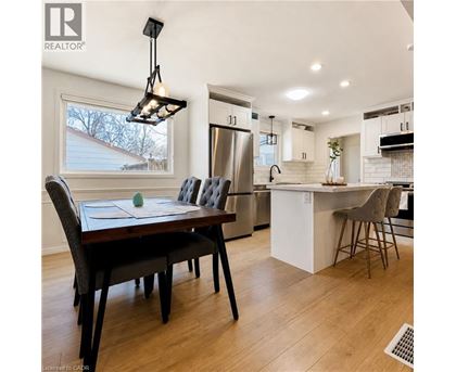 A modern kitchen with a dining table and chairs.