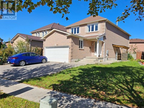 A blue car is parked in front of a house.