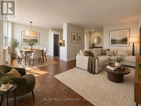 A living room with a couch, chairs, and a dining table.