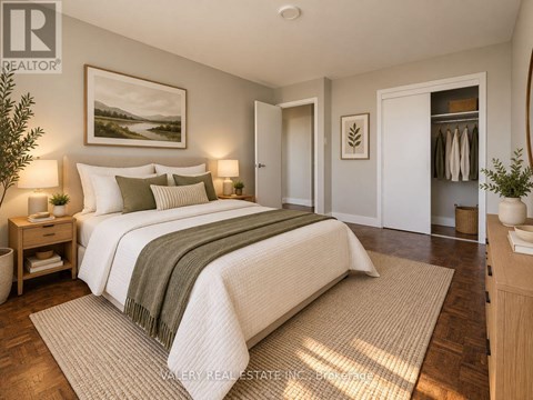 A bedroom with a large bed and a painting on the wall.