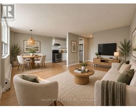 A living room with a couch, chairs, and a coffee table.