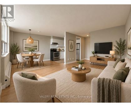 A living room with a couch, chairs, and a coffee table.