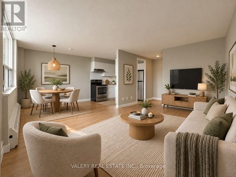 A living room with a couch, chairs, and a coffee table.