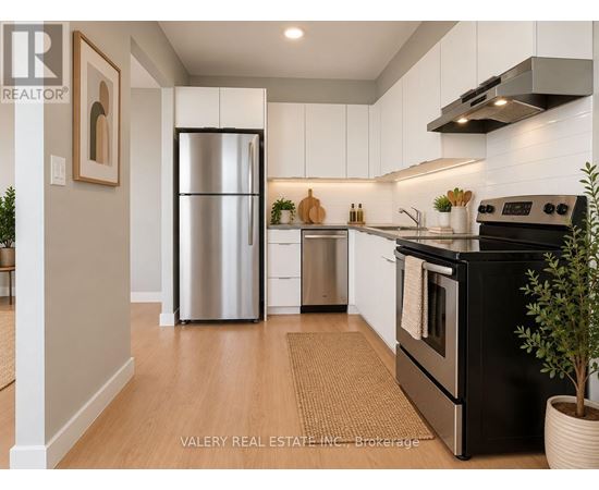 A modern kitchen with a black stove top oven and a stainless steel refrigerator.