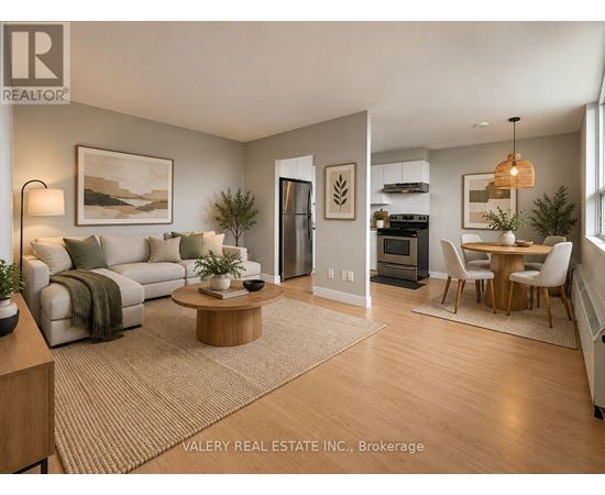 A living room with a couch, coffee table, and a dining table.