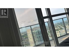 A view from a high-rise building looking out over a cityscape.