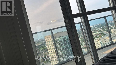 A view from a high-rise building looking out over a cityscape.