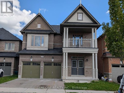 A two-story house with a garage is for sale.