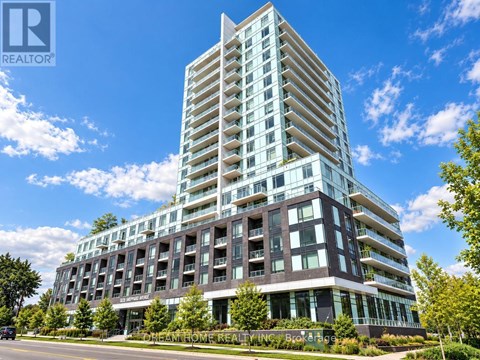 A modern multi-story building with a glass facade.
