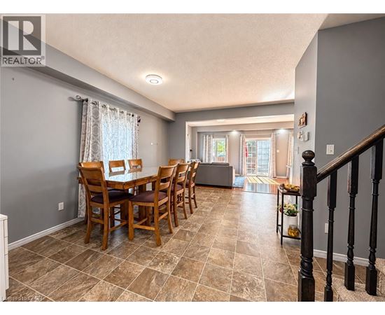 A dining room with a table set for six.