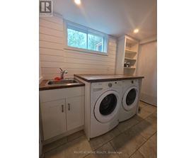 A laundry room with a washer and dryer.